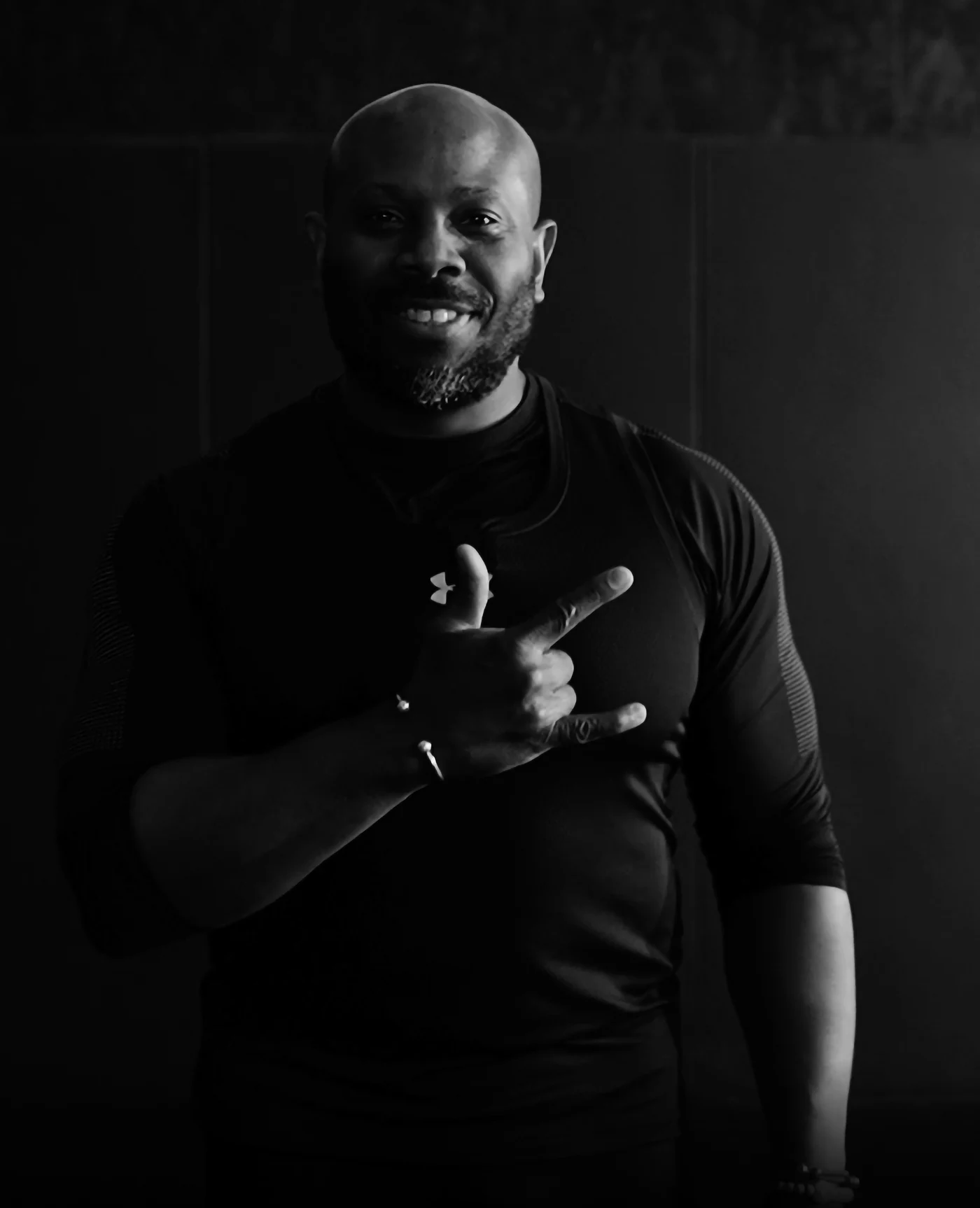 A smiling portrait of Chris, the teacher behind Yoga Inclusive