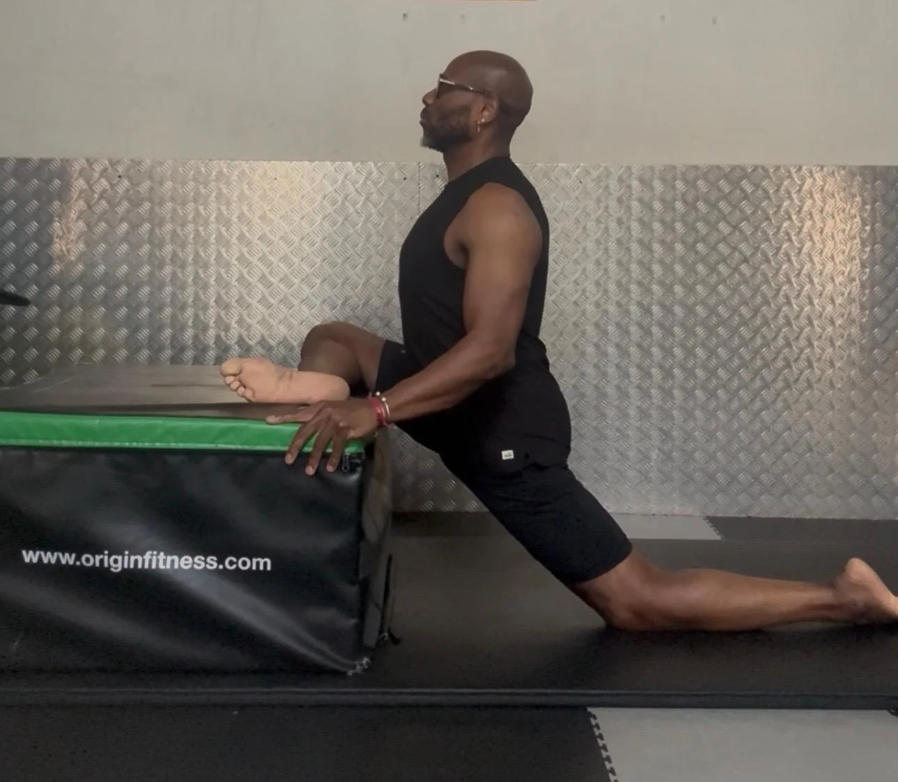Chris practising a yoga pose at Fitness 4 Less